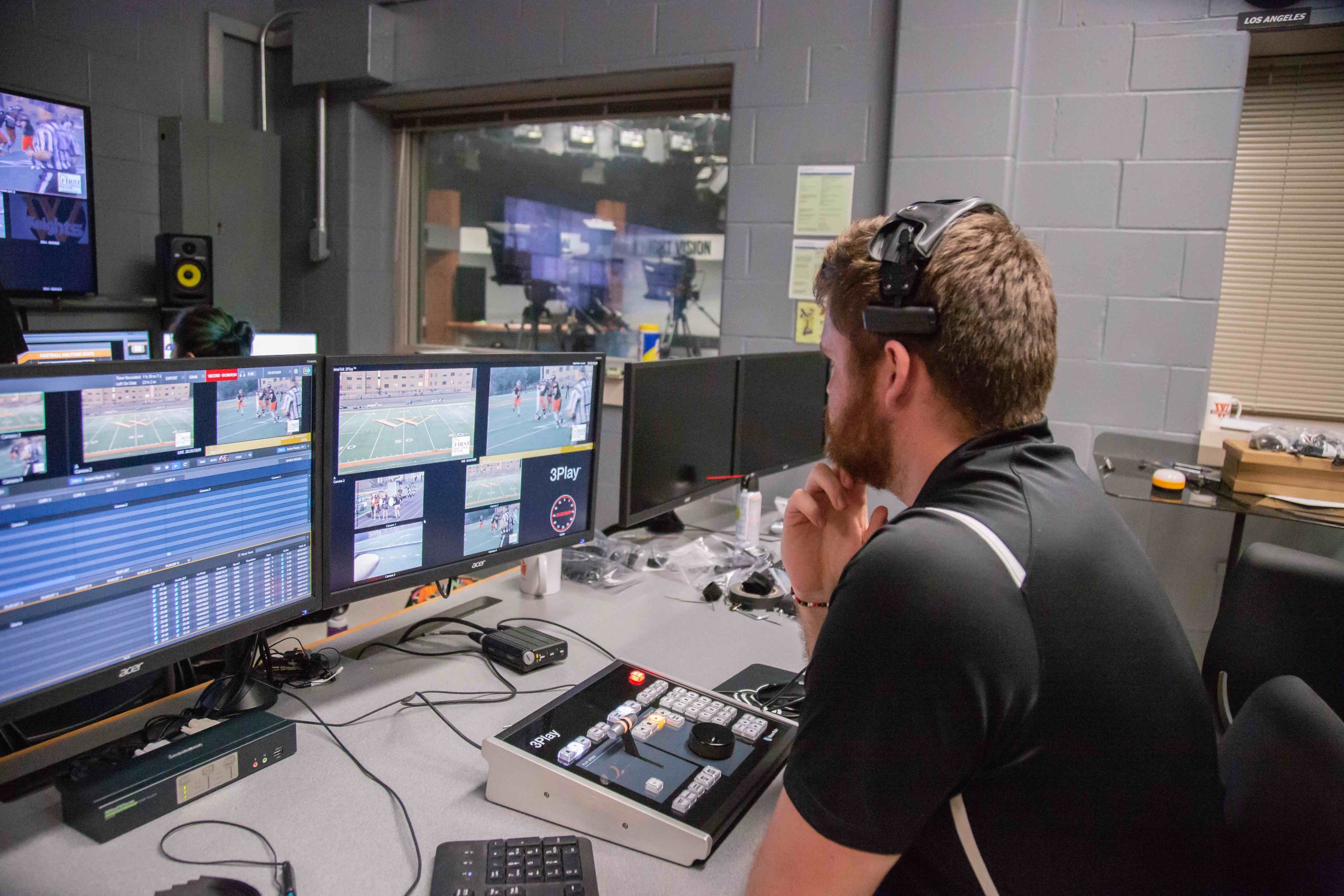 Josh Voigt ’20 works in the Knight Vision production booth during a home football game.