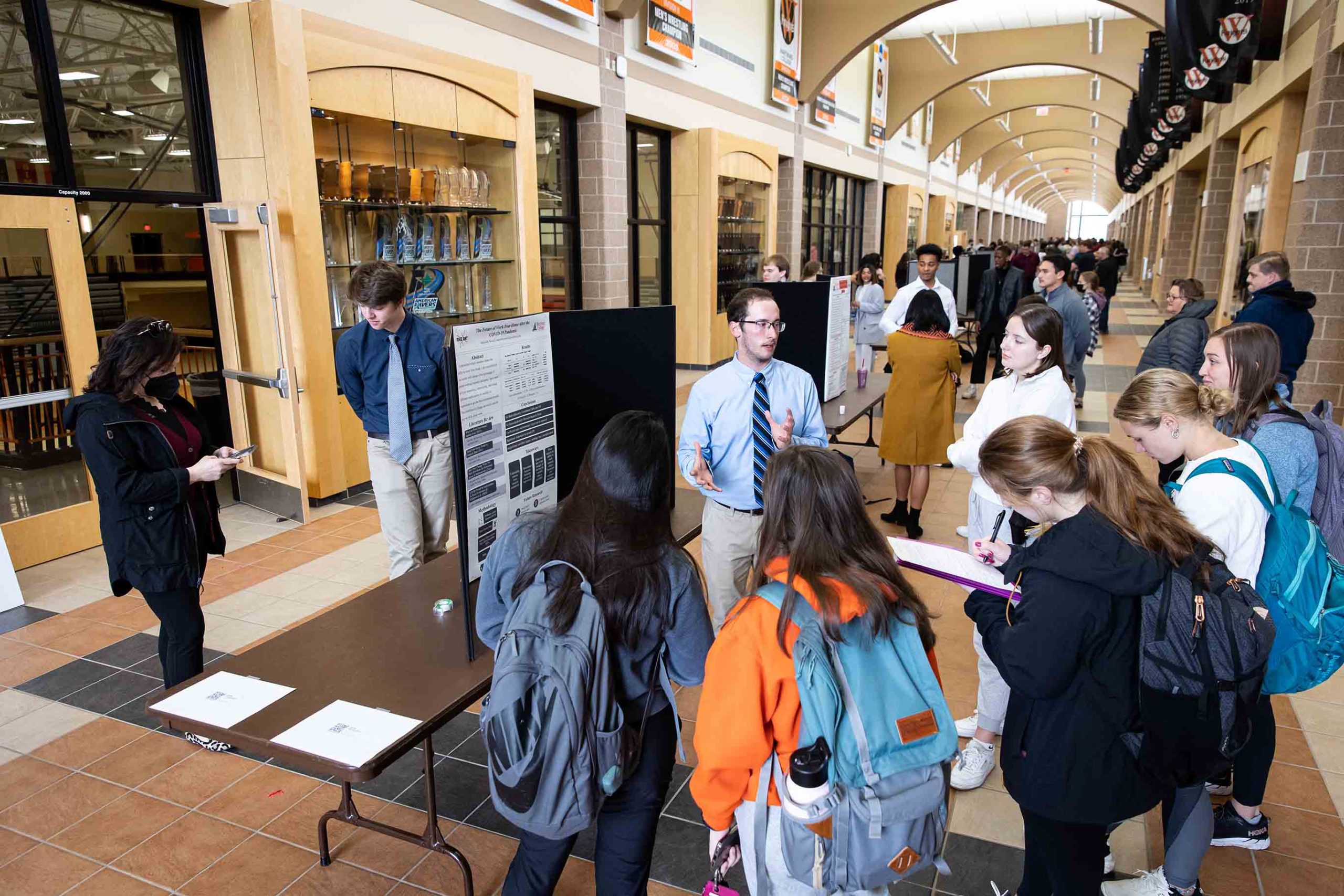 Students present their research in the Hall of Champions on RICE Day 2022