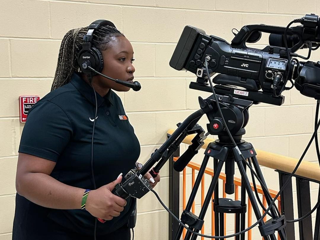 Student filming live stream of a game