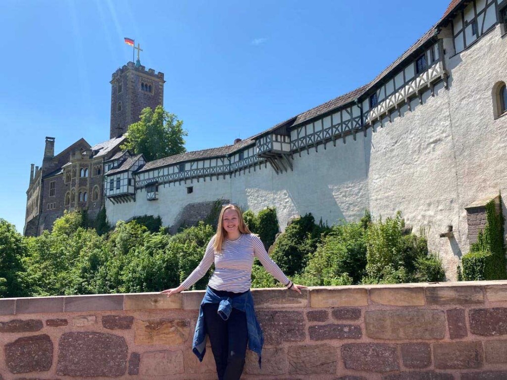 Emily Hansel in front of the Wartburg Castle in Germany