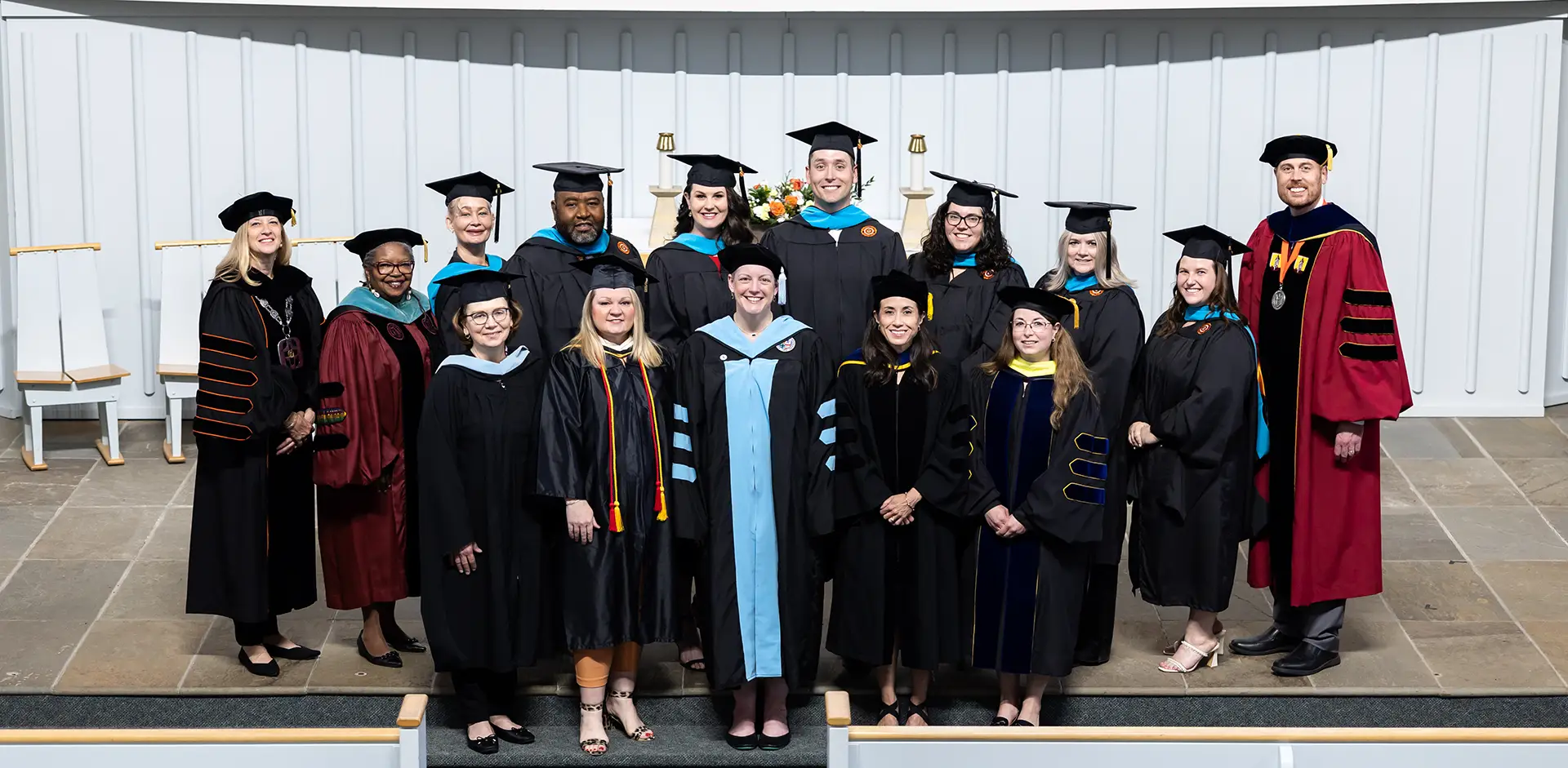 Masters degree graduates with their faculty in the Wartburg Chpael