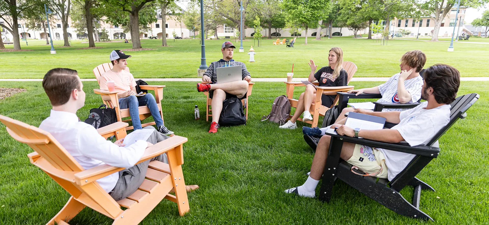 Political science class meeting outside on the campus mall