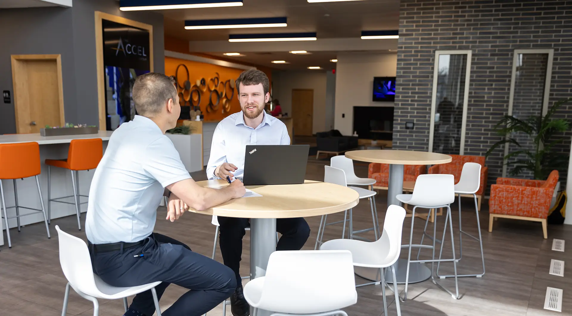 Student interning with Accel Group having conversation with supervisor