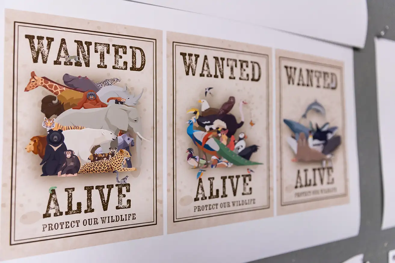 three Wanted Alive posters show endangered animals in a campaign to save them