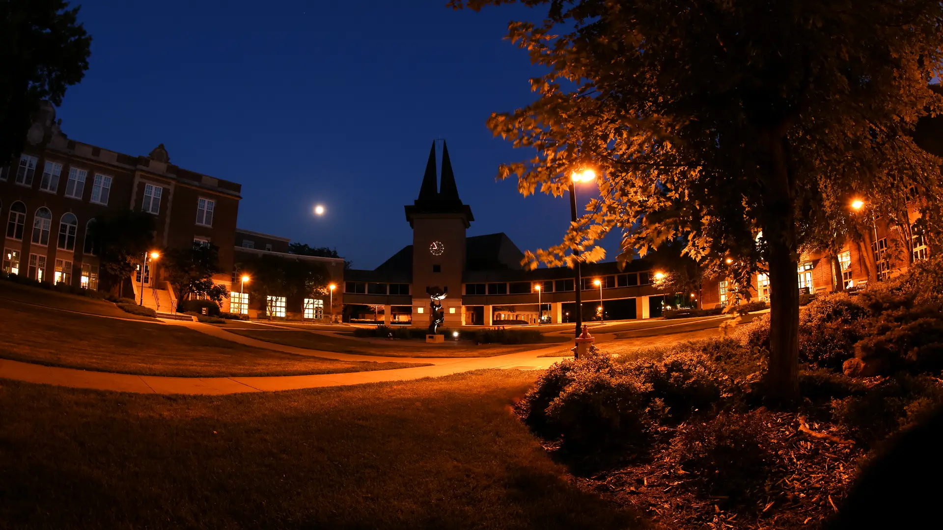 Wartburg Chapel and south courtyard at night with the glow of the lights reflecting on the sidewalks