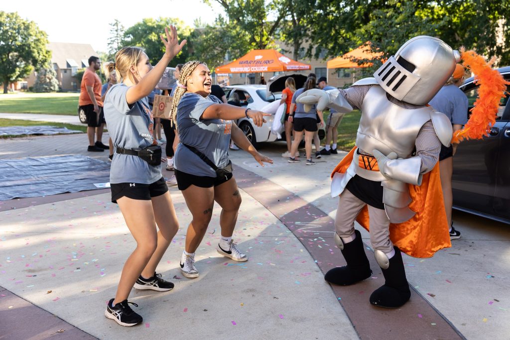 Students dancing with Sir Victor