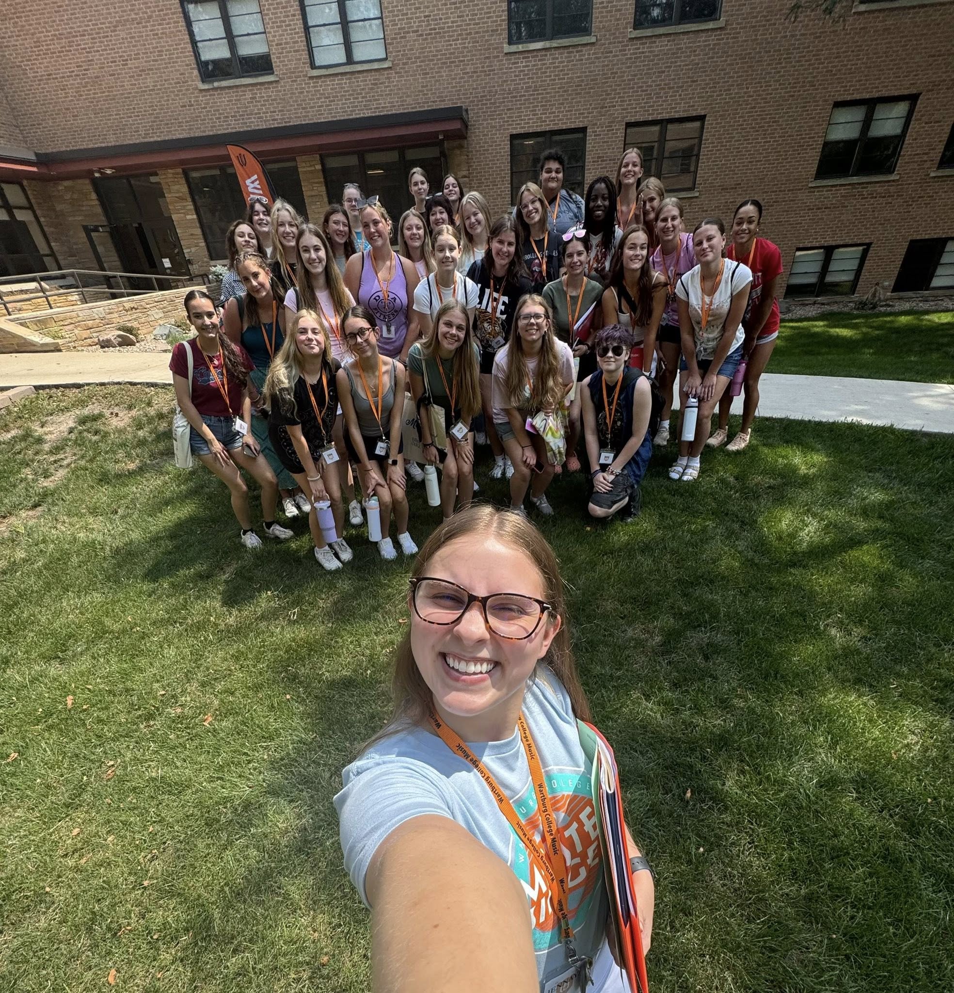 All State music camp counselor with group of students