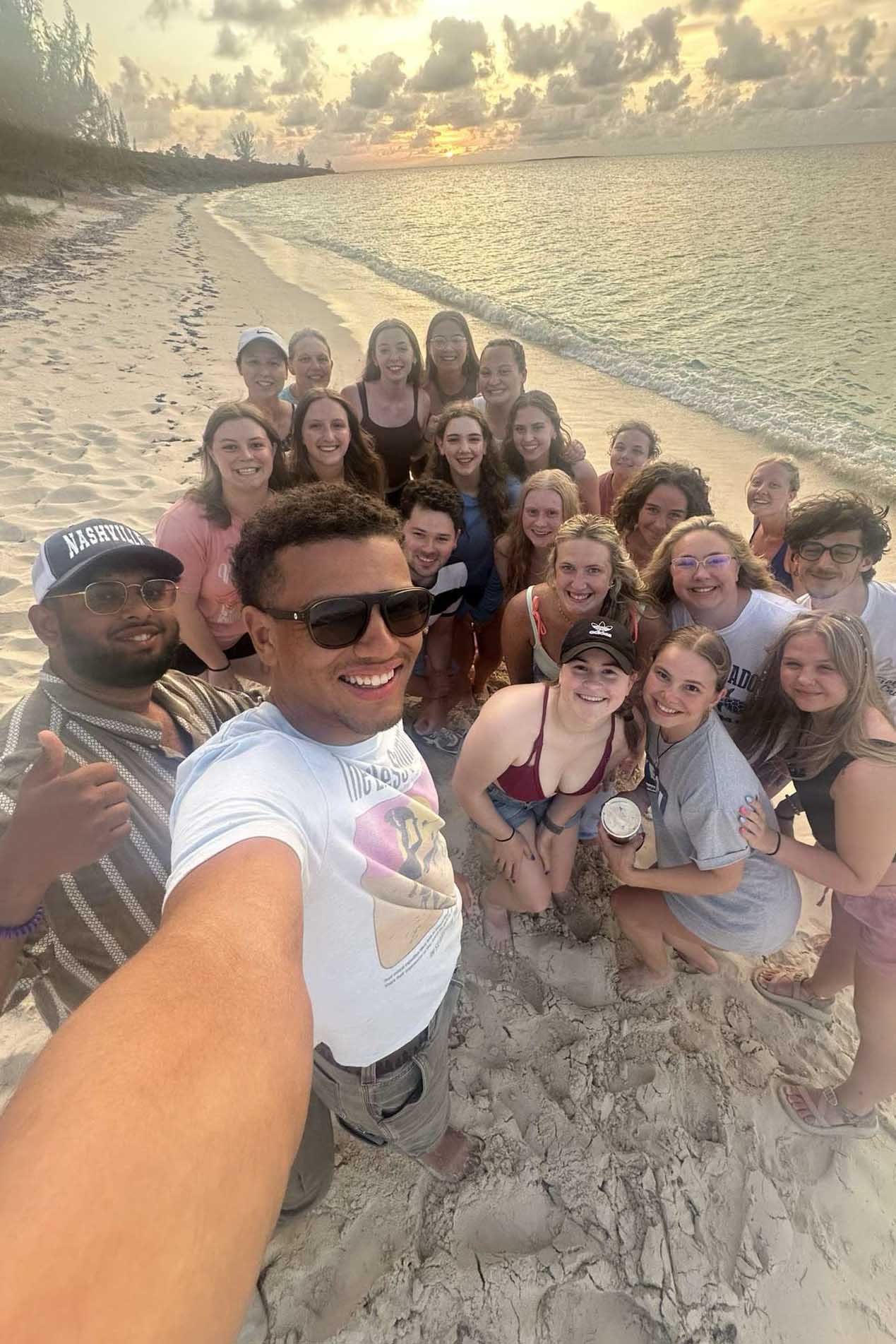 Students gathered for group photo on the beach
