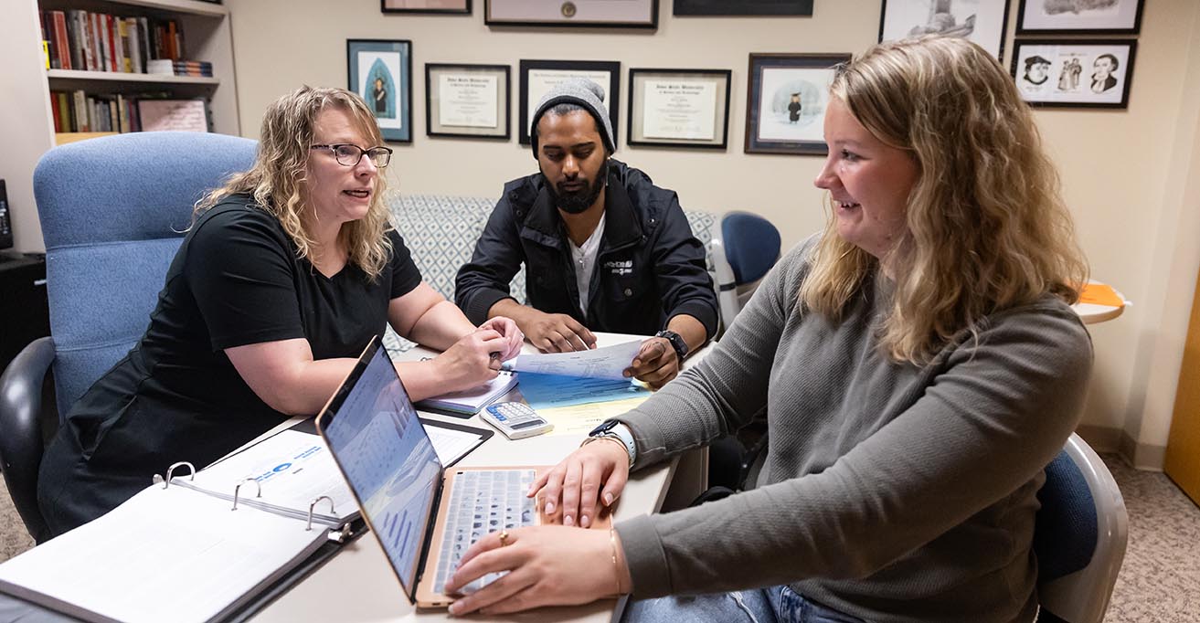 Business Professor Advising Students