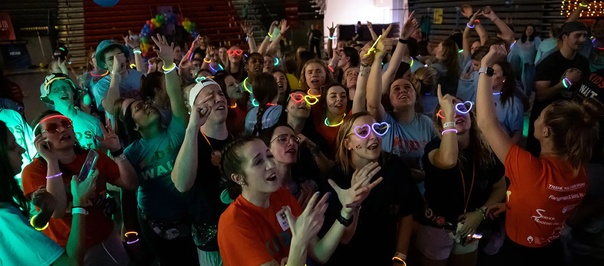 Dance Marathon - students dancing in the dark with glow sticks