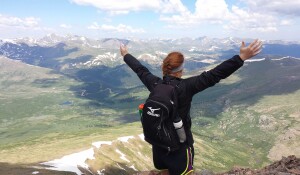Student taking in breathtaking view in the mountains