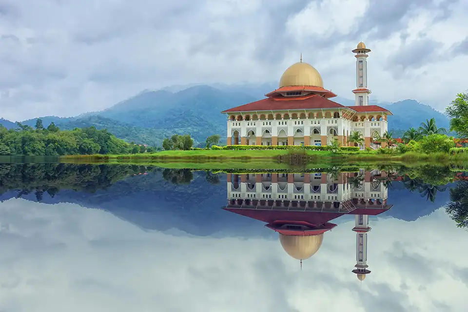 Mosque with water in the foreground