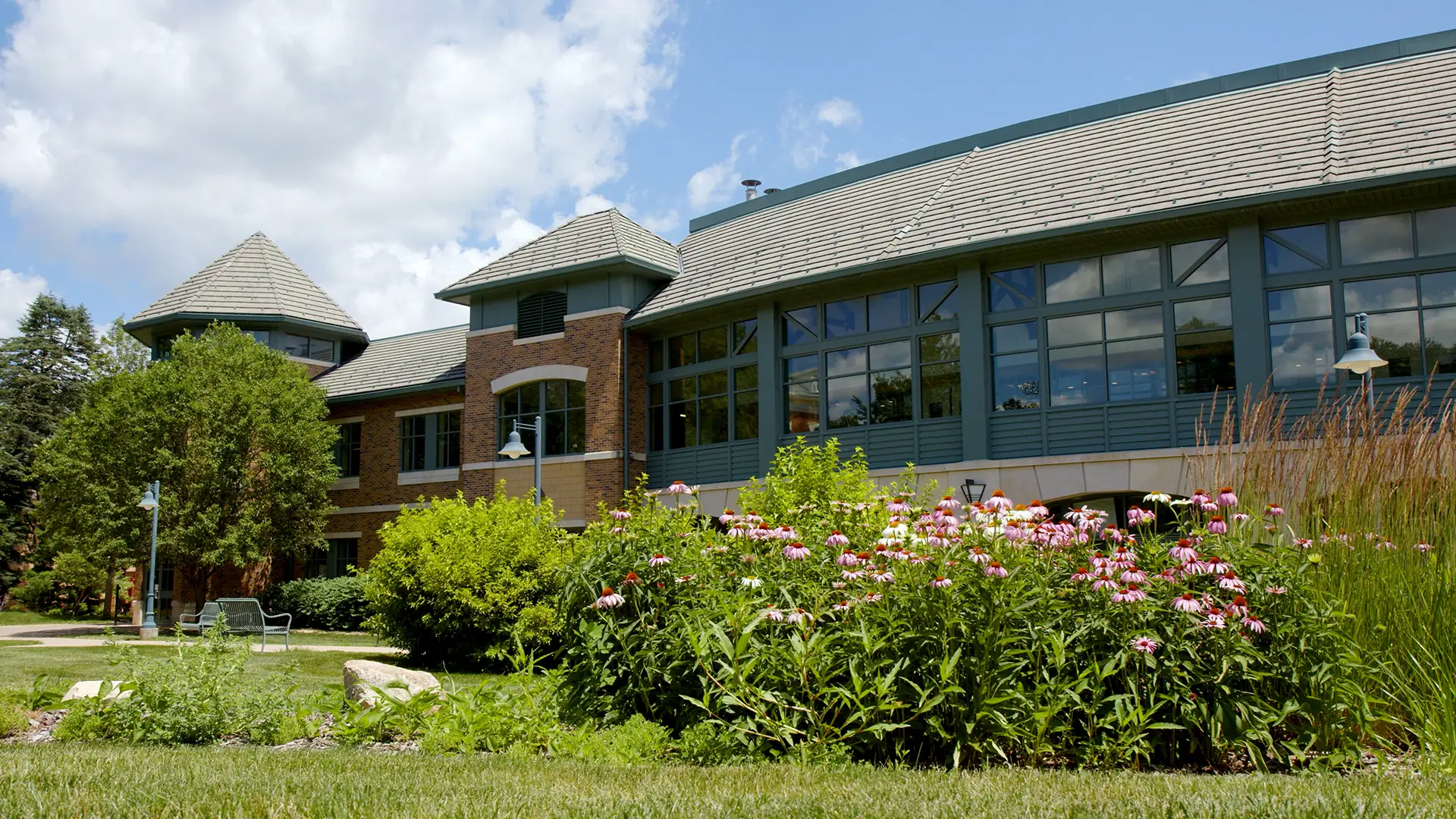 Saemann Student Center with beautiful flowers in foreground