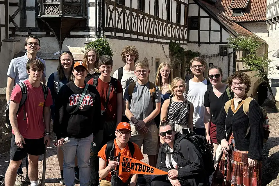 Wartburg students gather for a photo in the Wartburg Castle courtyard