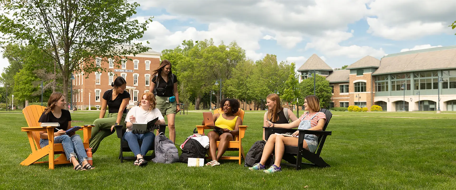 Students sitting on the campus mall