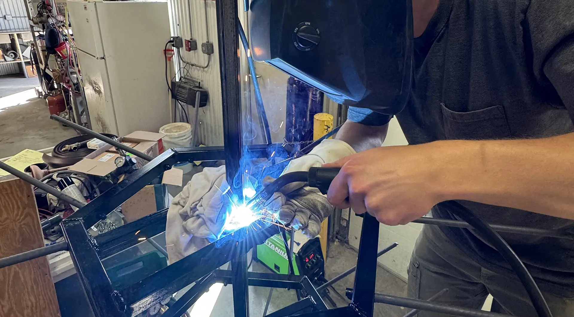 Student welding an engineering project