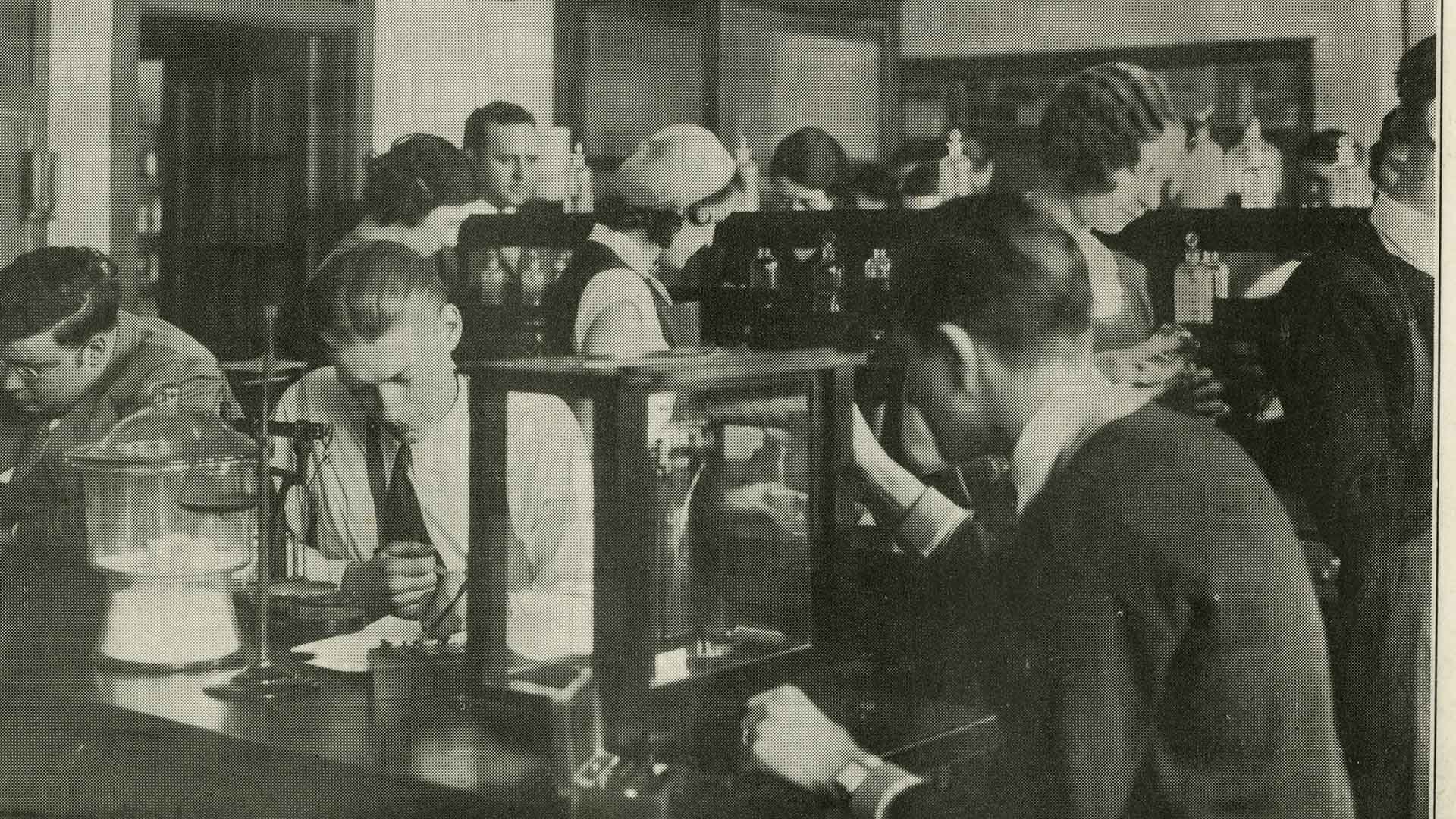 Students work in a chemistry lab in Luther Hall in 1932
