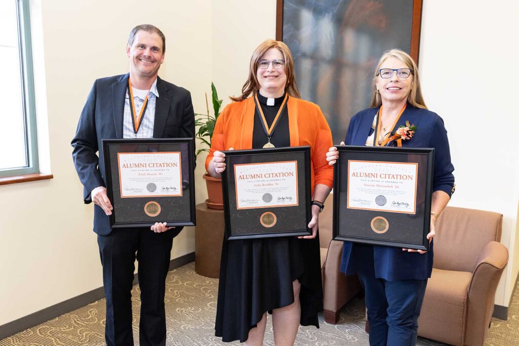 Erich Heneke, The Rev. Erika Breddin, and Dr. Stacene Maroushek stand with their Alumni Citation plaques