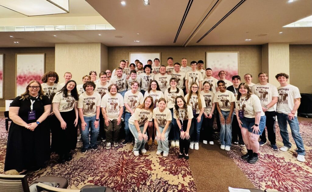 Wartburg students pose in a large group prior to a rehearsal at Carnegie Hall. 