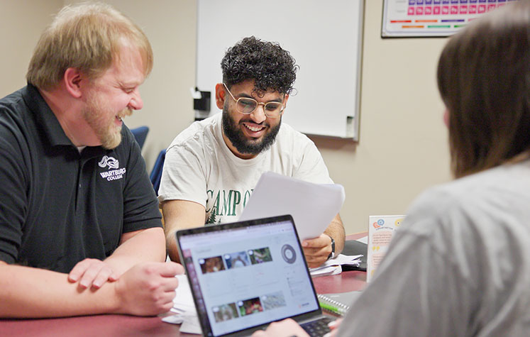 Academic Advising Coordinator meets with students about their academic goals