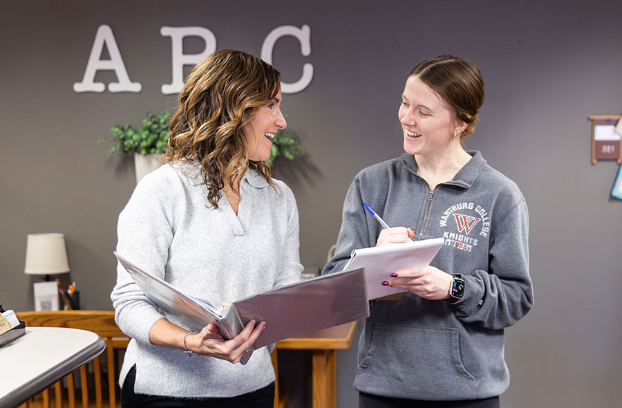 Disability and access coordinator works with a student