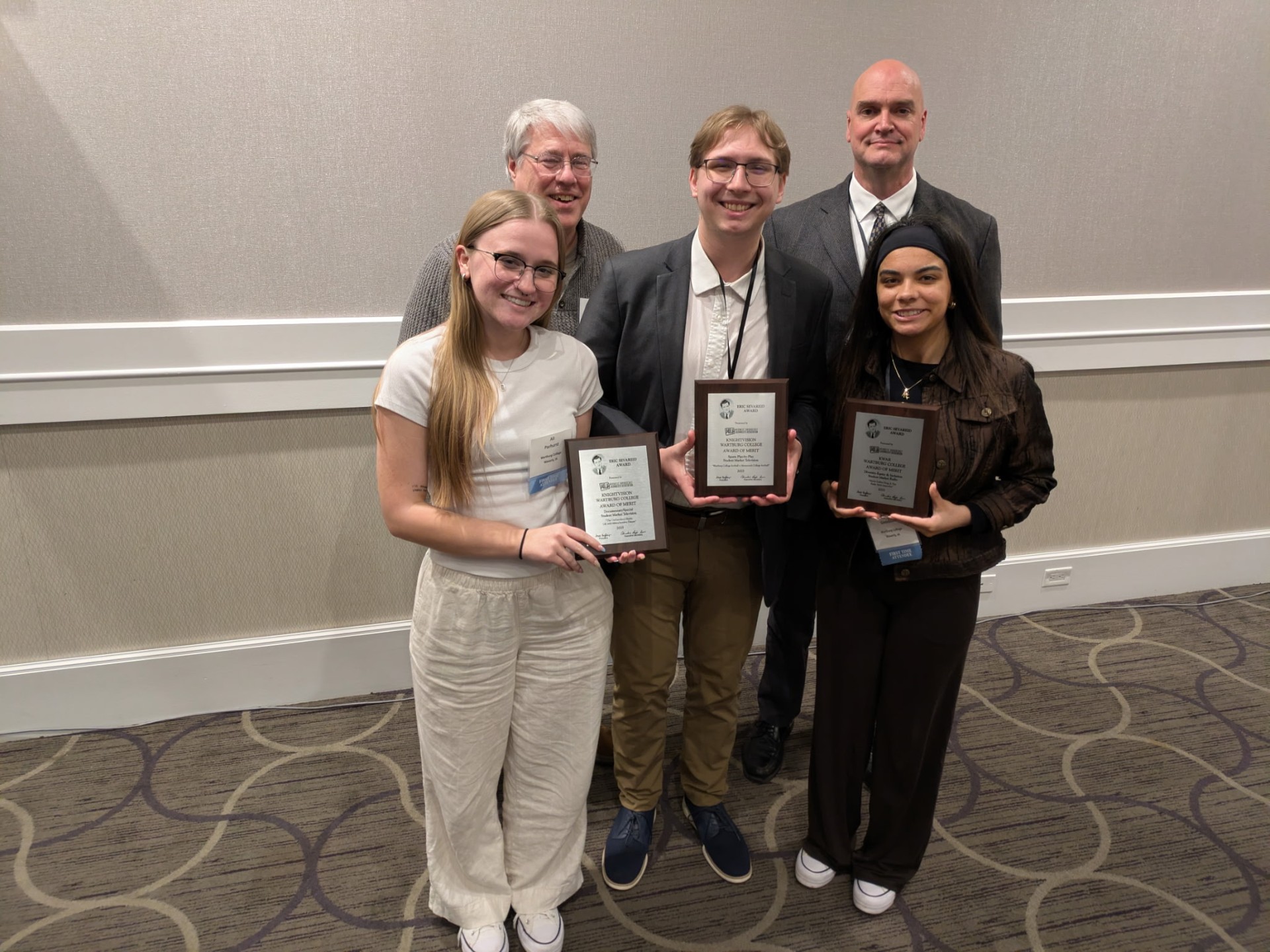 (front left to right) Ali Parkhurst, Caleb Kammerer, Karma Goodson each holding an award plaque. Back row left to right Ron Johnson and Will Buss