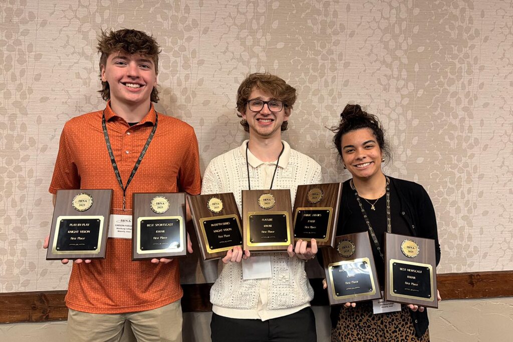 Carson Foelske, Jace Holz, and Karma Goodson hold awards won by KWAR and Knight Vision staff.