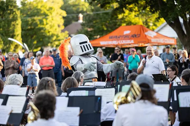 Sir Victor conducts the Waverly Municipal Band during Concerts in Kohlmann.