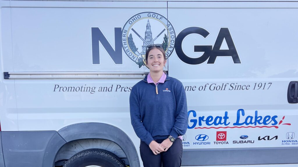 Lydia Miller stands in front of the Northern Ohio Golf Association trailer