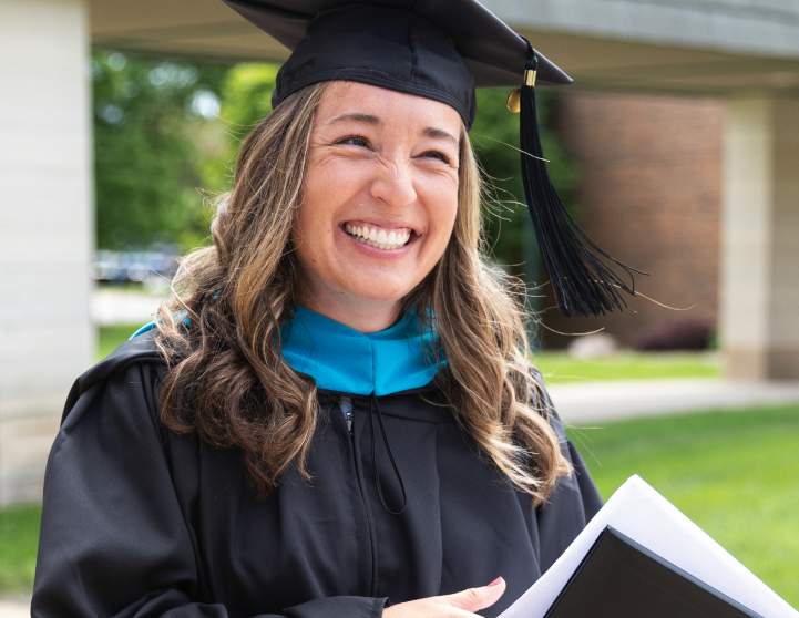 Graduate student in robe smiling