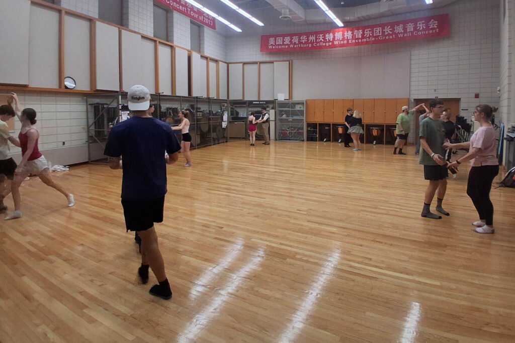 Couples practice Swing Dance in the Wartburg band room